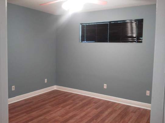 Freshly painted and new LVP flooring in bedroom